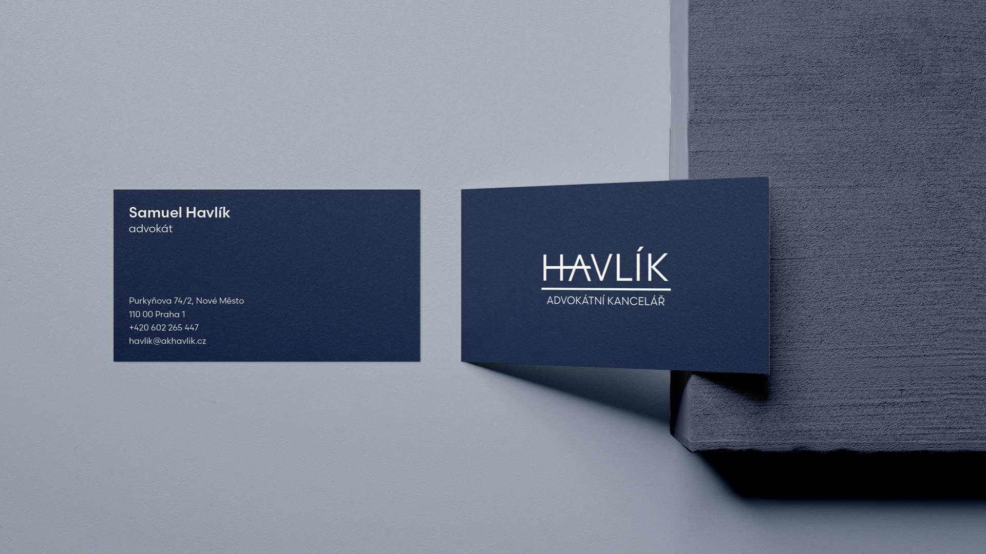slide 28. A business card for a layperson named Havlík.